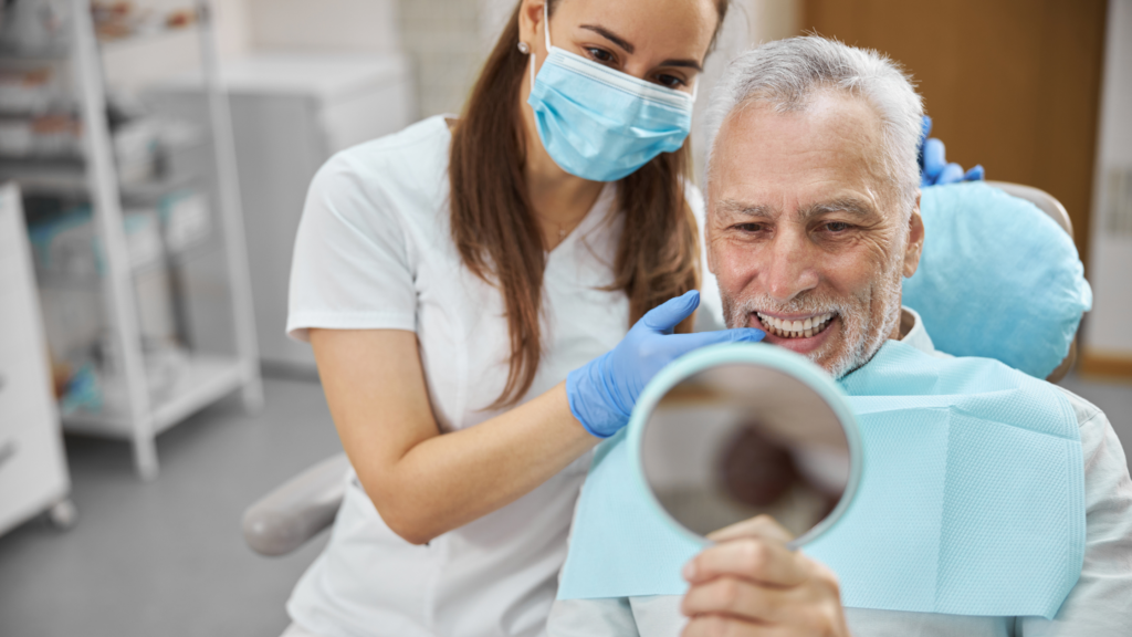 Aging gentleman being happy with his new dental implant