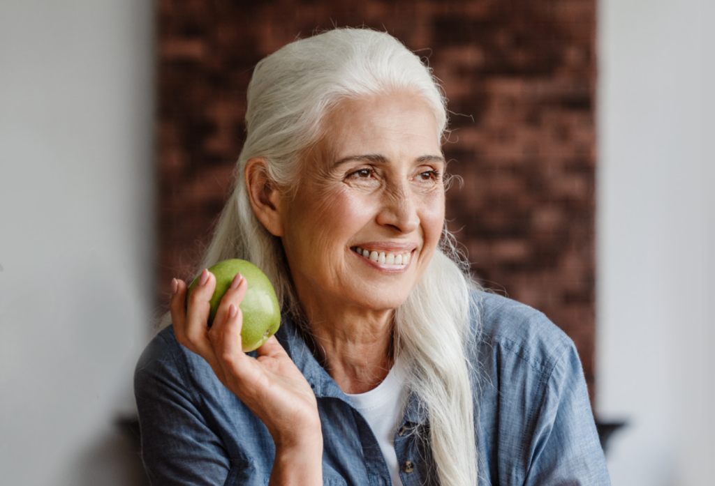 senior with dental implants